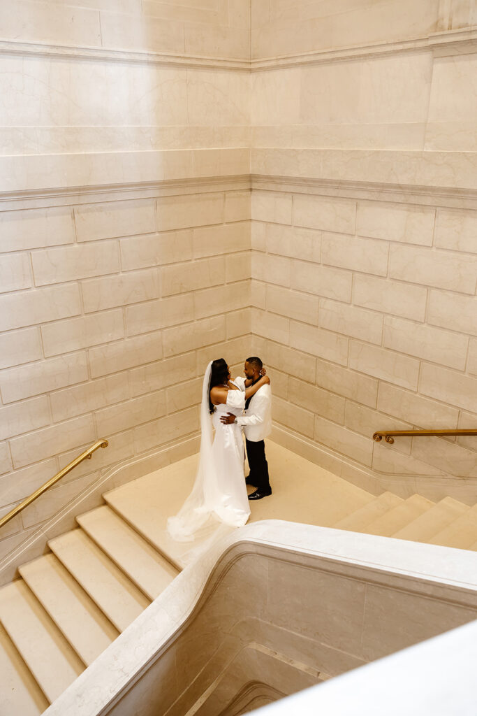 bride and groom on the steps at the national gallery of art