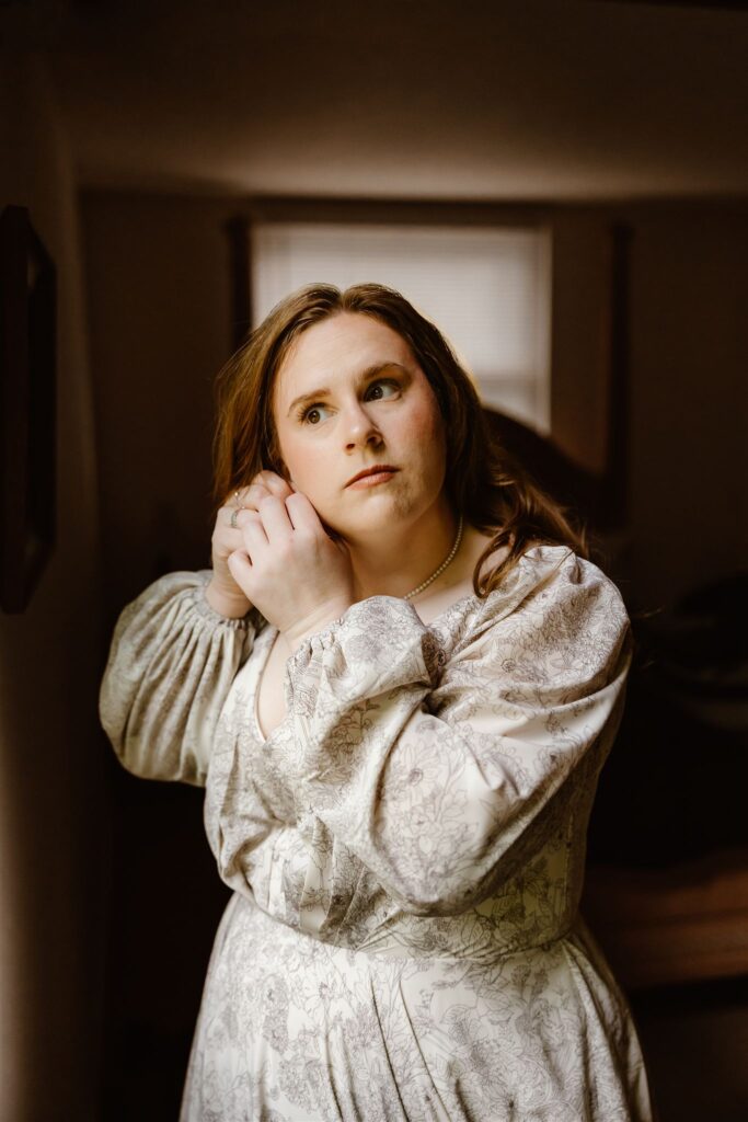 bride putting finishing touches to her elopement look