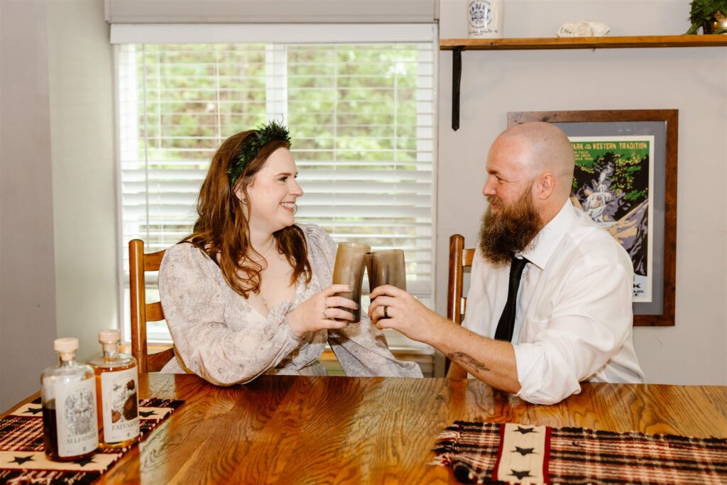bride and groom enjoying mead and cupcakes