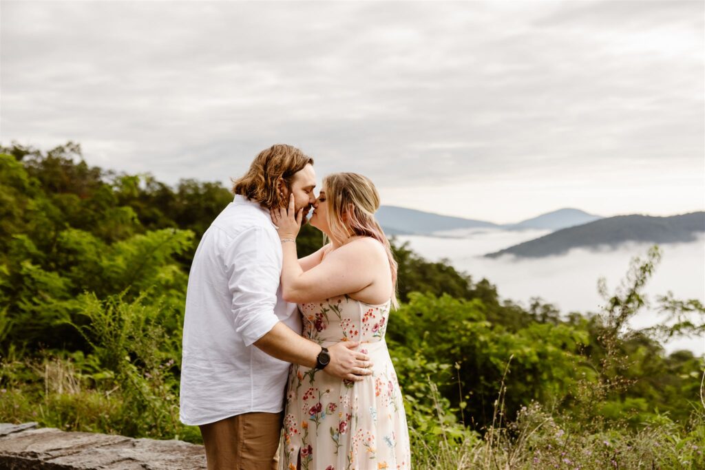 bride and groom hugging at a mountain overlook in shenandoah national park