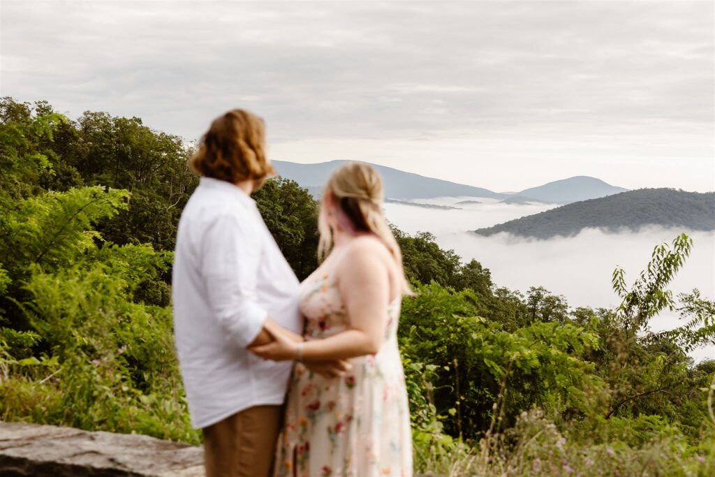 bride and groom hugging at a mountain overlook in shenandoah national park