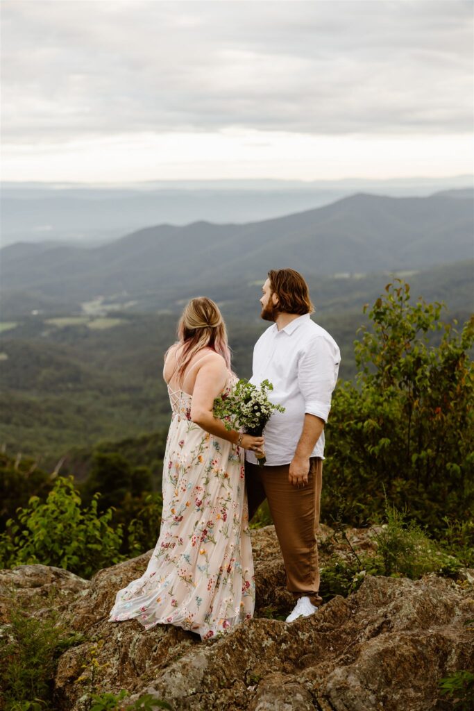 bride and groom at a mountain overlook in shenandoah national park