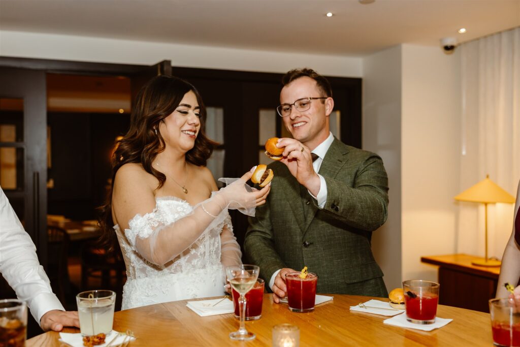 bride and groom hanging out with the guests at lyle hotel and restaurant during their dc micro wedding