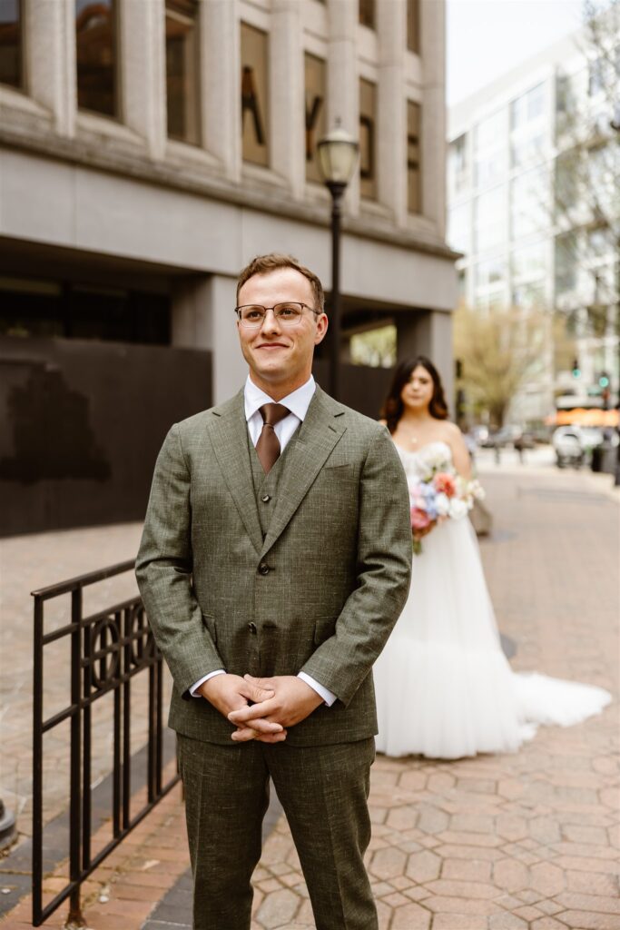 bride and groom emotional first look for their elopement in front of their hotel in washington dc