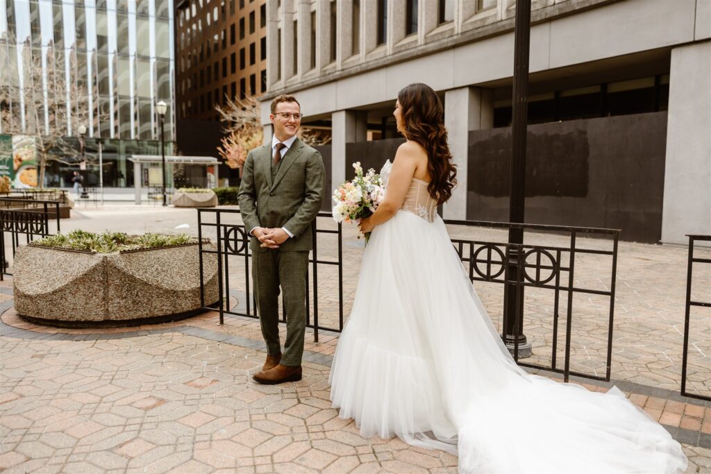 bride and groom emotional first look for their elopement in front of their hotel in washington dc