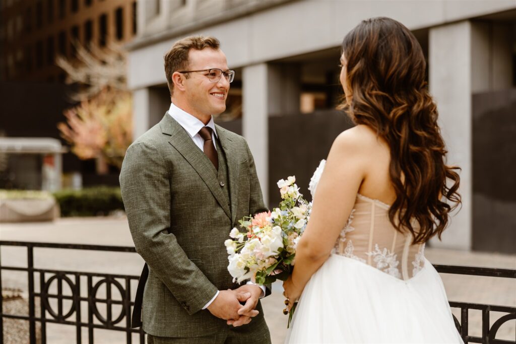 bride and groom emotional first look for their elopement in front of their hotel in washington dc