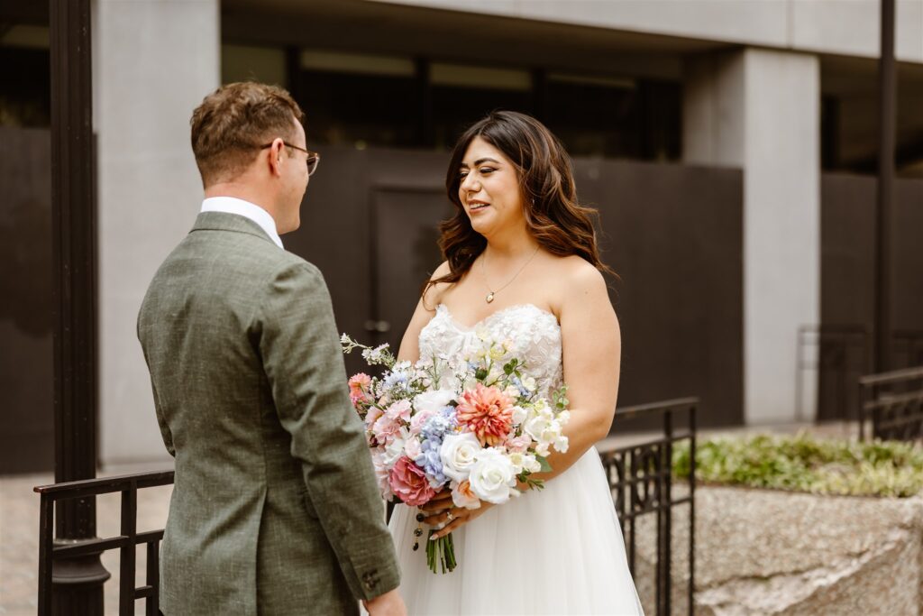 bride and groom emotional first look for their elopement in front of their hotel in washington dc