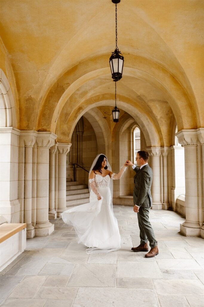 bride and groom exploring the national cathedral grounds during their dc cherry blossom wedding day