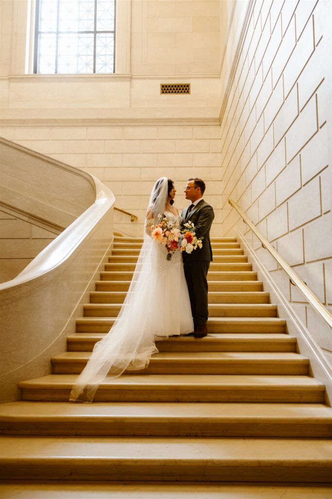 bride and groom on the steps at the national gallery of art