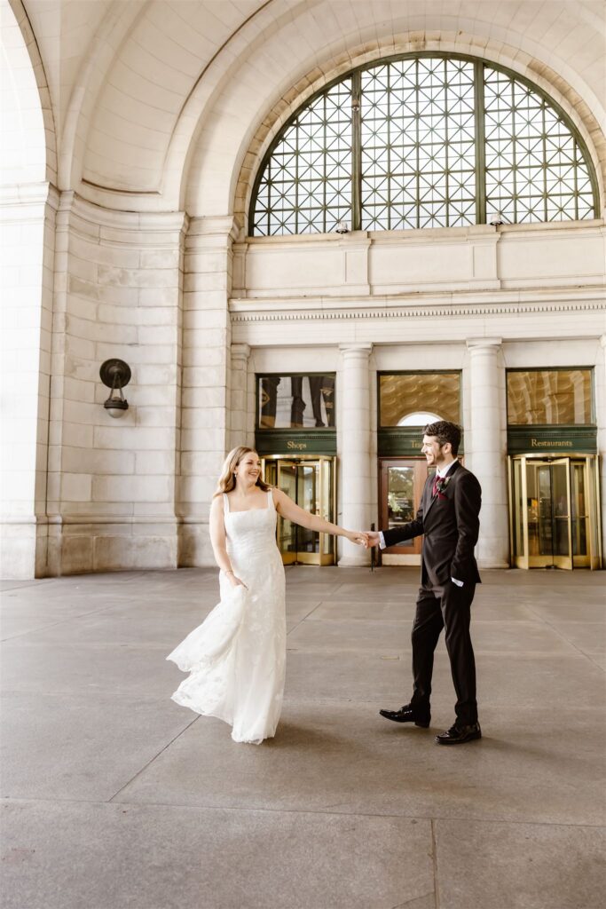 playful elopement couple at union station
