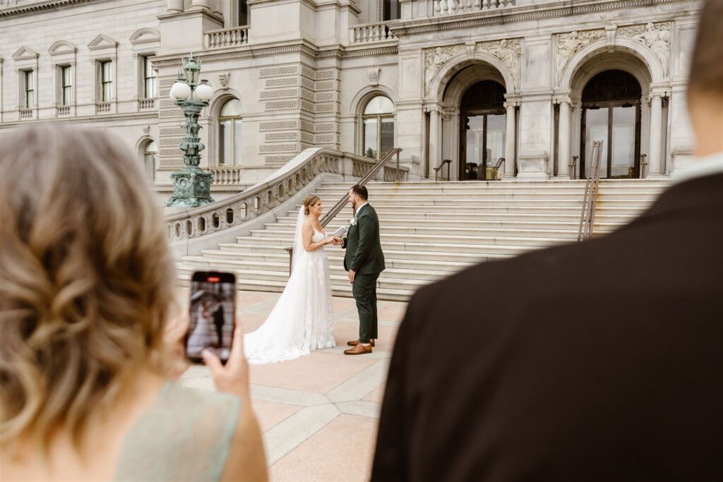bride and groom elopement ceremony in front of the library of congress