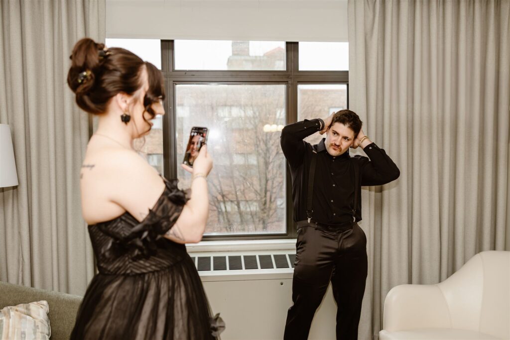 bride and groom having fun at the hotel as they are getting ready for their elopement