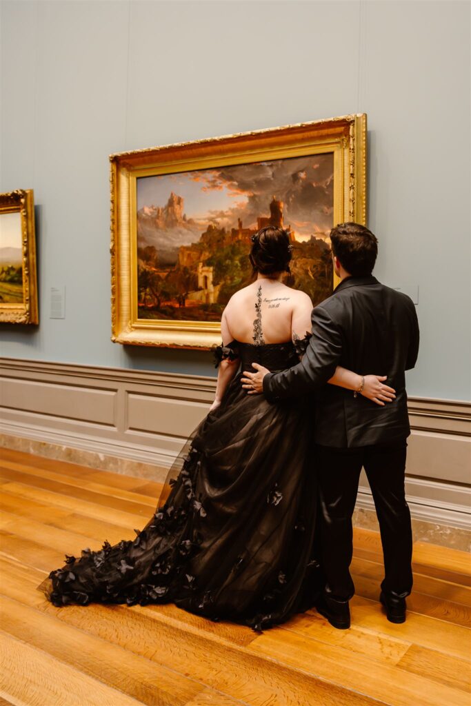 gothic elopement couple enjoying art during their dc elopement at the national gallery of art