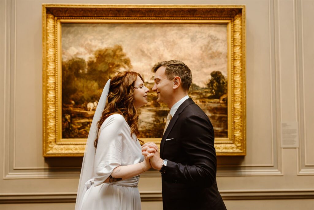 bride and groom exploring the national gallery of art during their two day elopement adventure