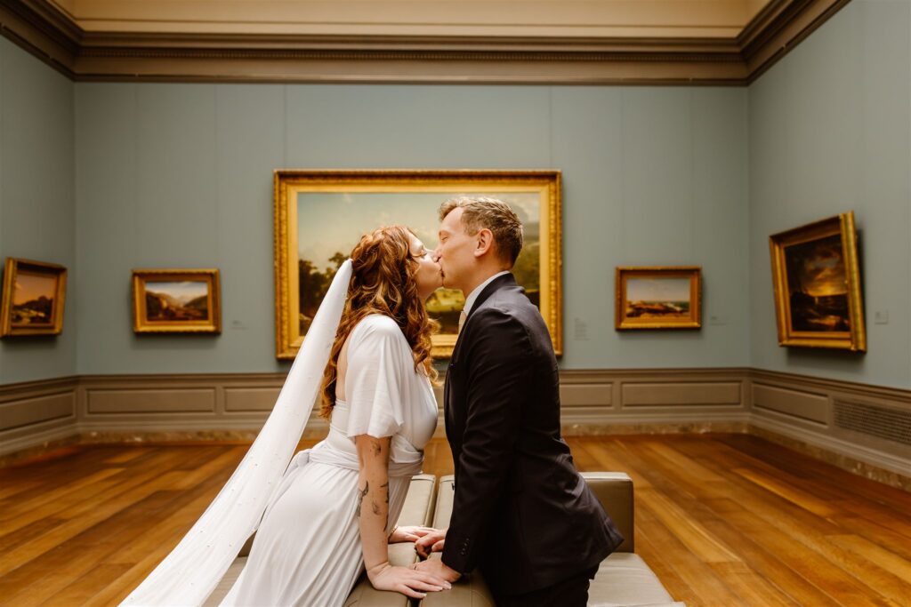 bride and groom exploring the national gallery of art during their two day elopement adventure