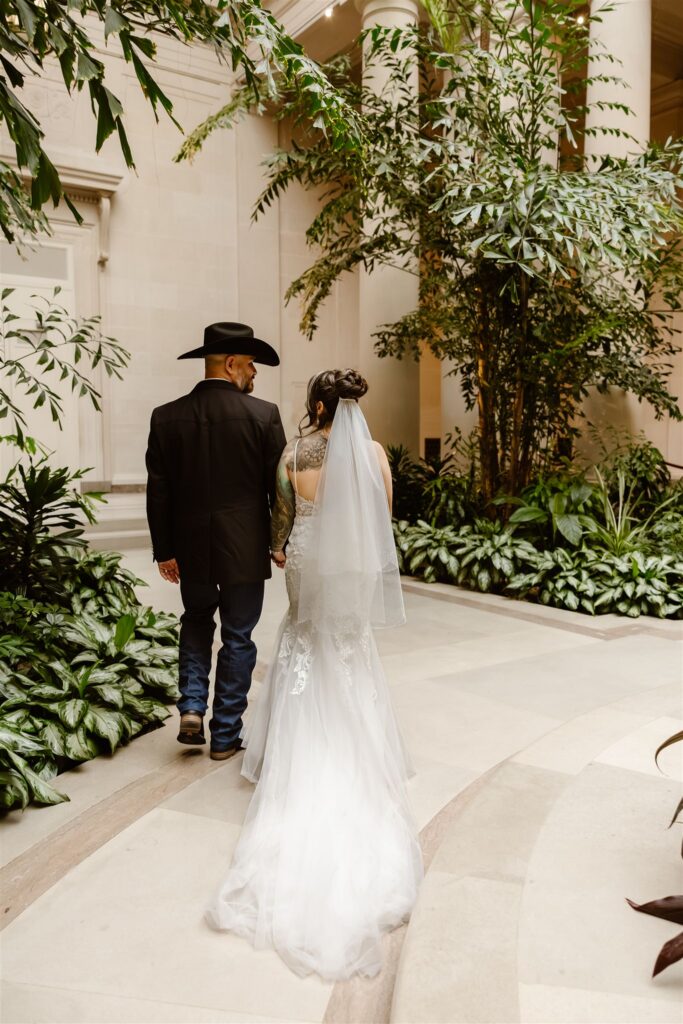 bride and groom exploring the national gallery of art in dc during their two day elopement in the city