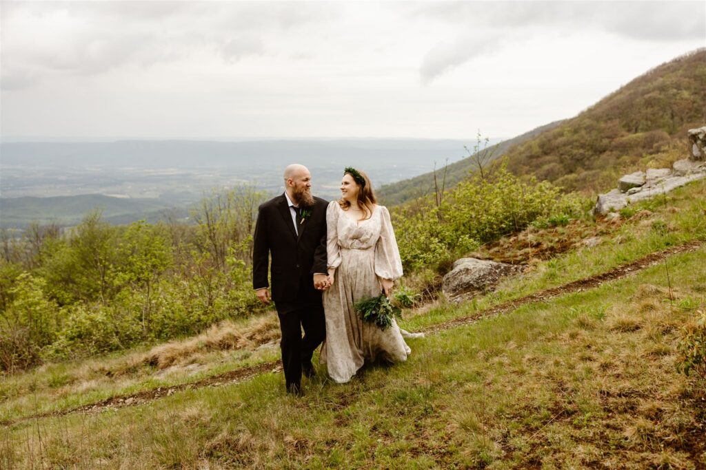 bride and groom exploring shenandoah national park during their two day elopement adventure