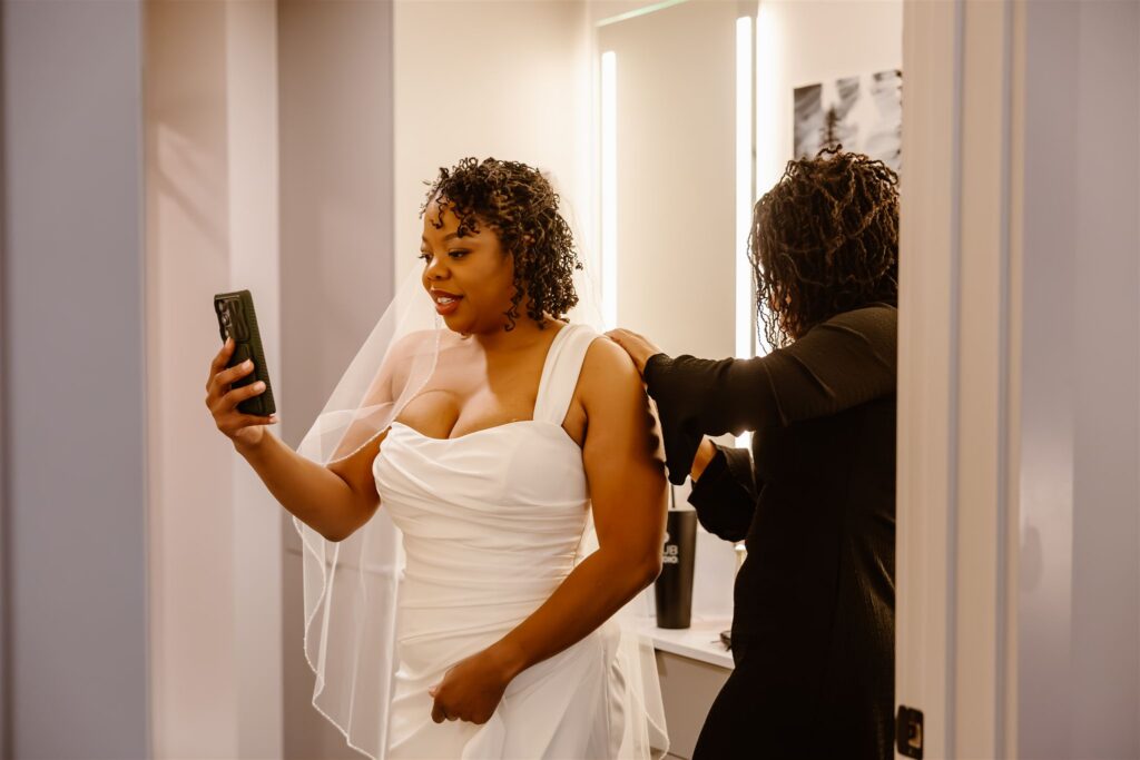 bride facetiming her family while getting ready