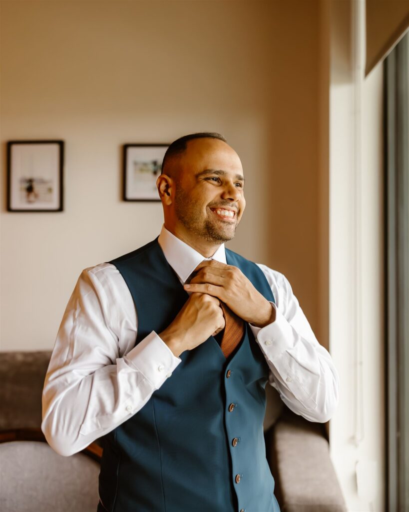 joyful groom getting ready