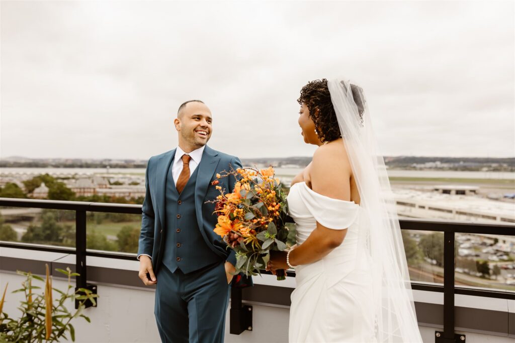 bride and groom first look on the rooftop of their apartment building 