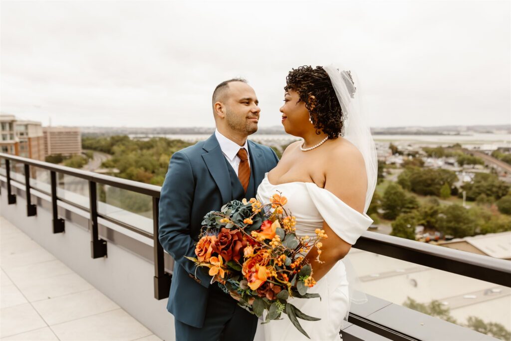 bride and groom first look on the rooftop of their apartment building 