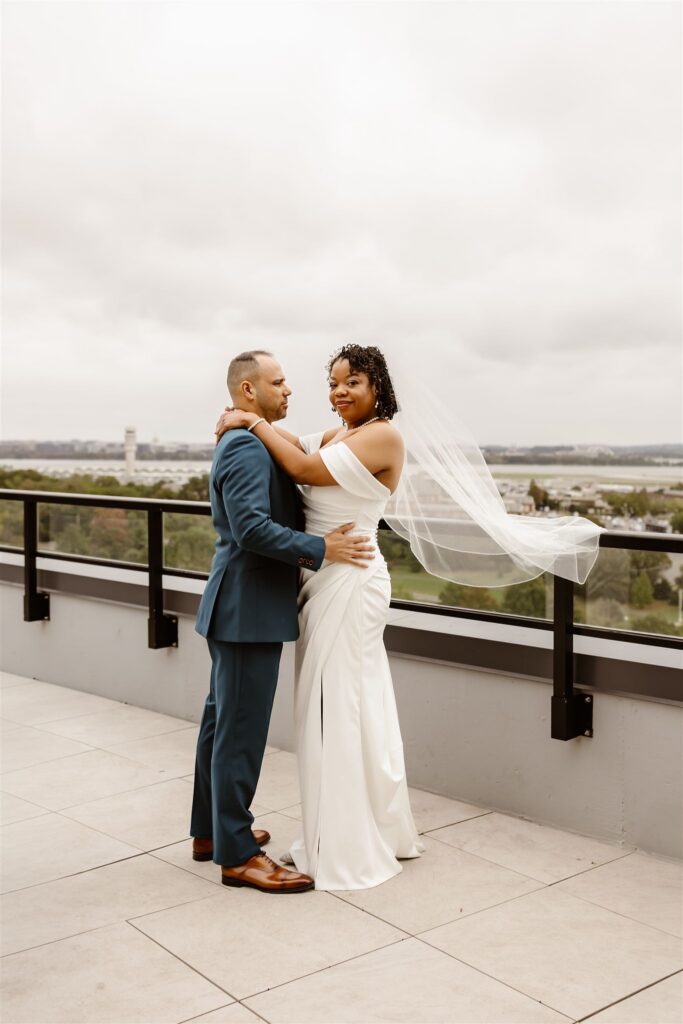 bride and groom first look on the rooftop of their apartment building 