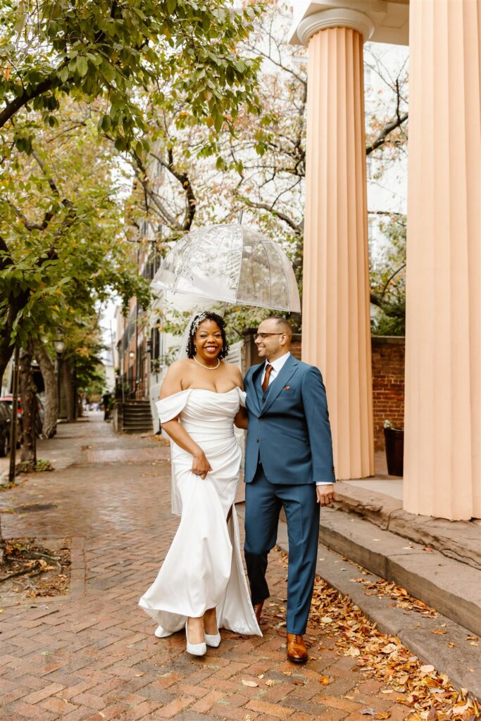 bride and groom having fun and exploring the cobblestone streets of Old Town Alexandria