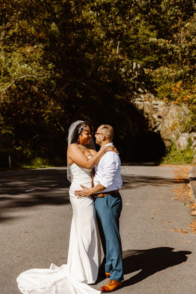 adventurous elopement couple hugging in shenandoah national park