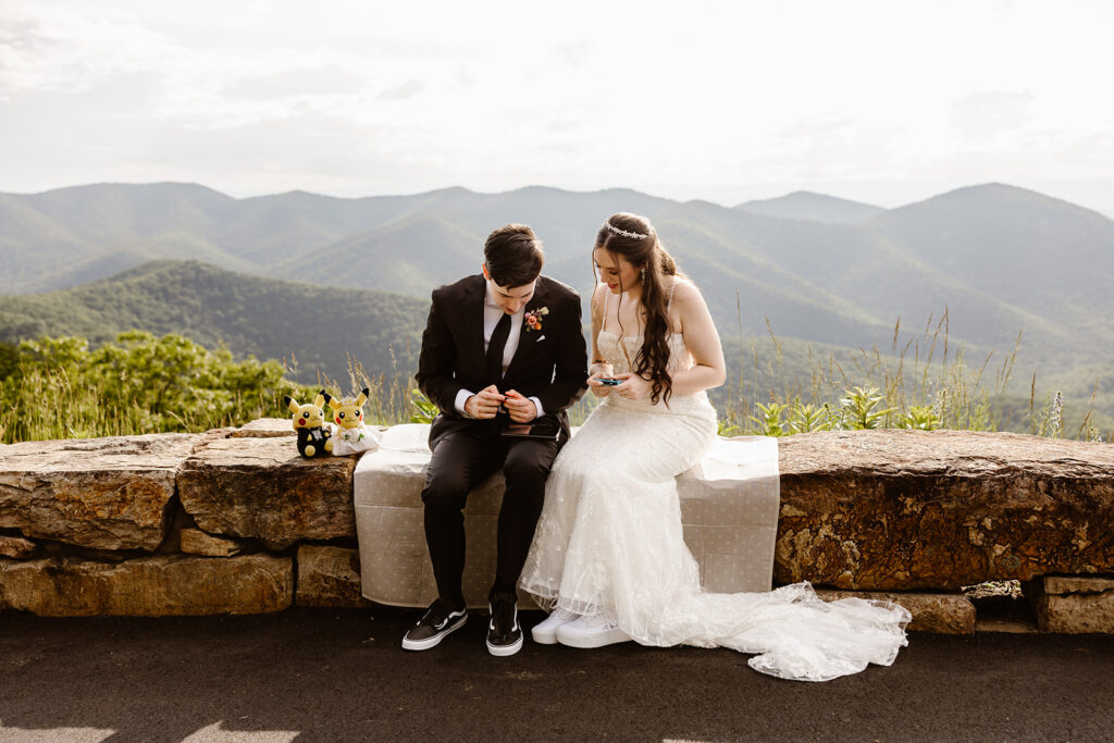 elopement couple sitting at a mountain overlook in shenandoah national park