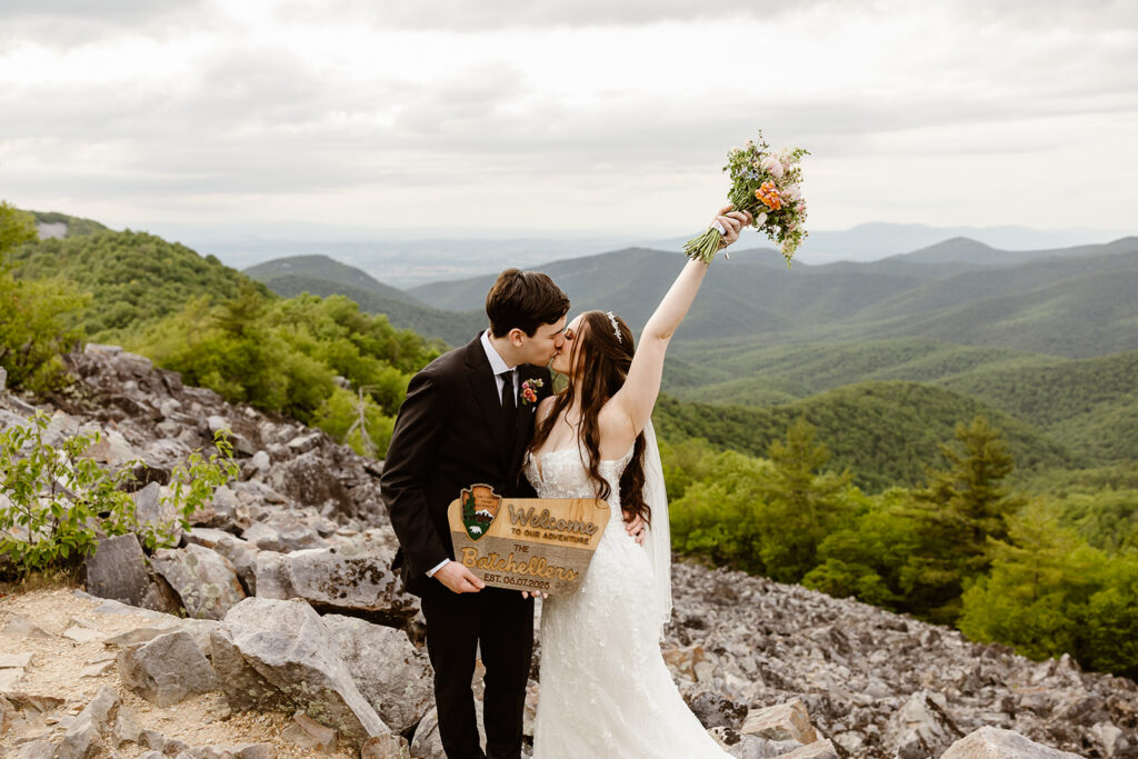 bride and groom with just eloped sign at shenandoah national park