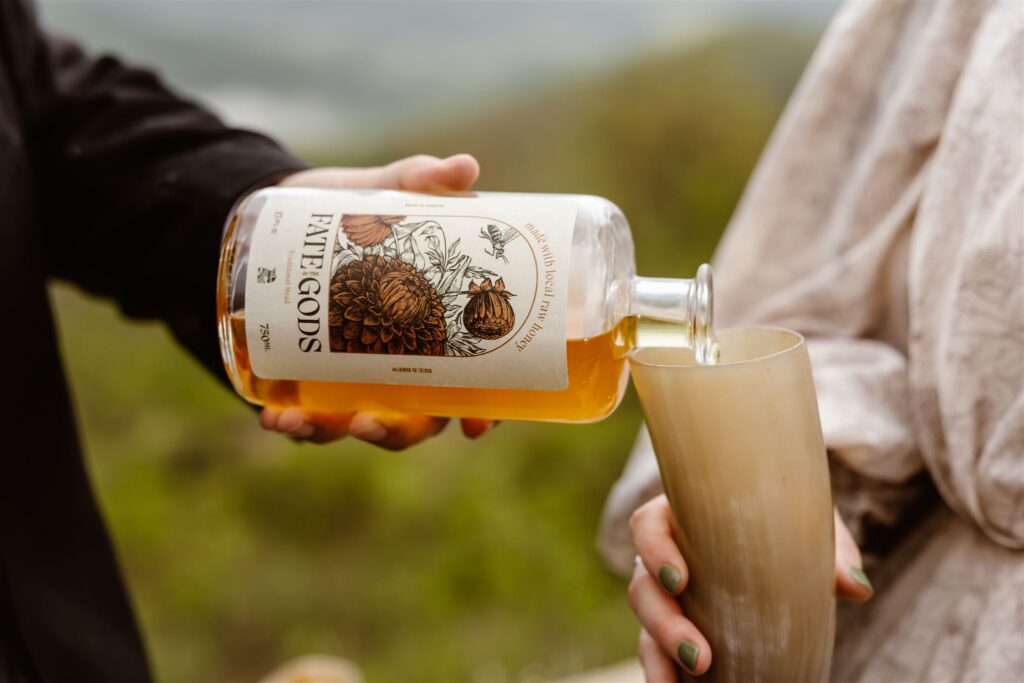 bride and groom drinking mead at a mountain overlook in shenandoah national park