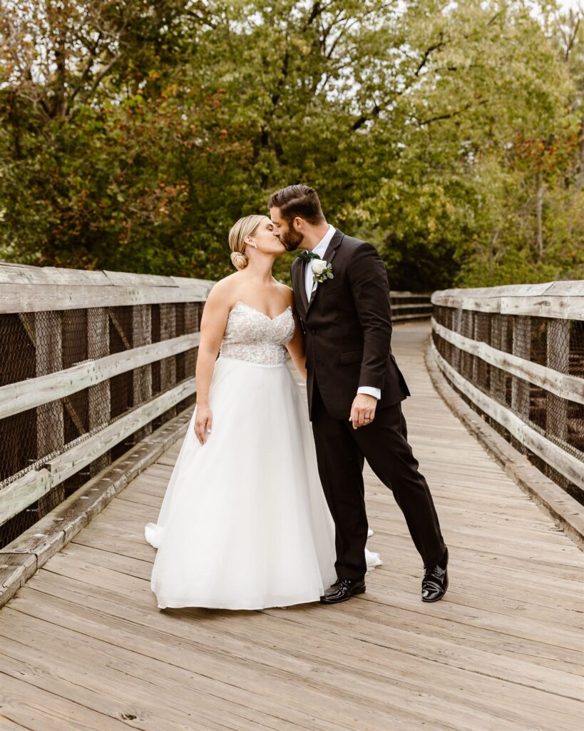 bride and groom kissing during their micro wedding at percivals island