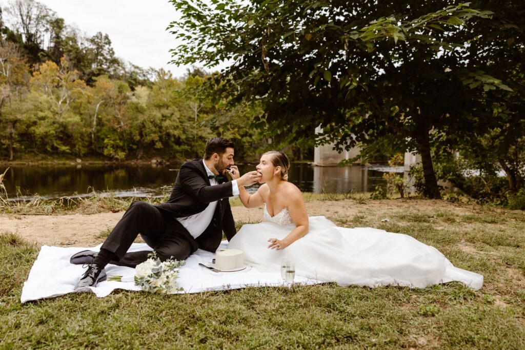 bride and groom having an intimate picnic during their micro wedding at percivals island