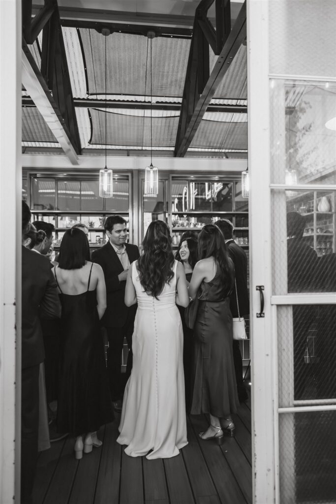 cocktail hour moments during a small restaurant wedding reception in Gravitas, DC