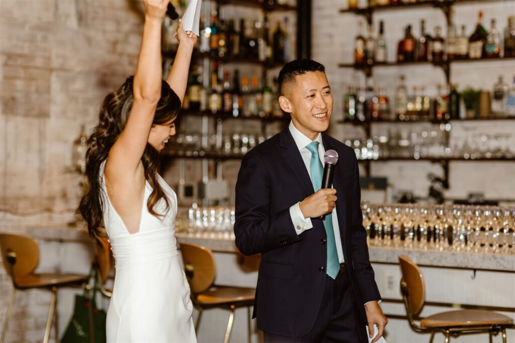 elopement couple making a speech during their small restaurant wedding reception in Gravitas, DC