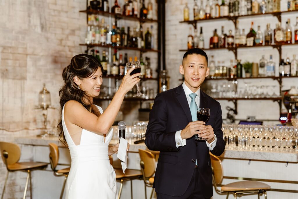 elopement couple making a speech during their small restaurant wedding reception in Gravitas, DC