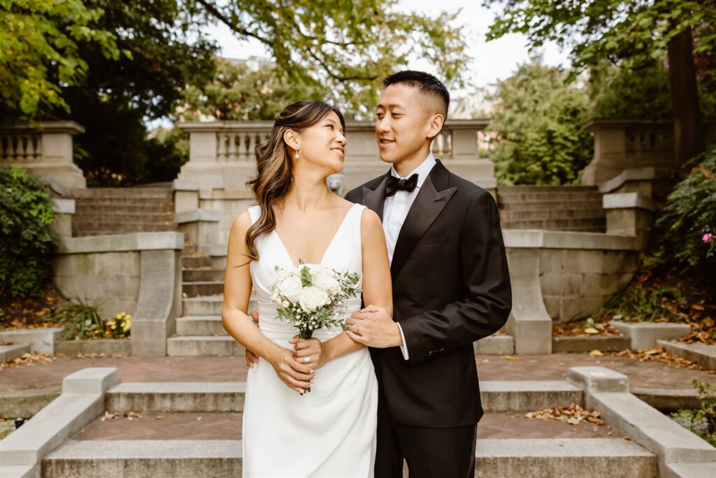 bride and groom posing on the spanish steps in washington dc