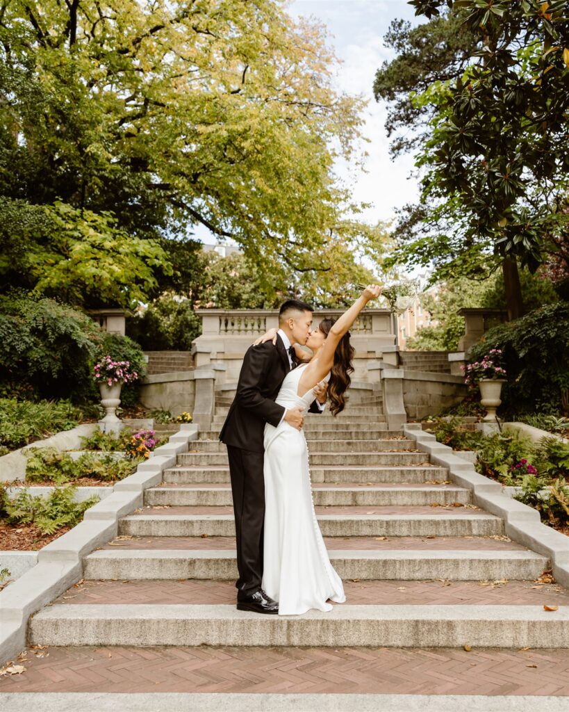 bride and groom posing on the spanish steps in washington dc