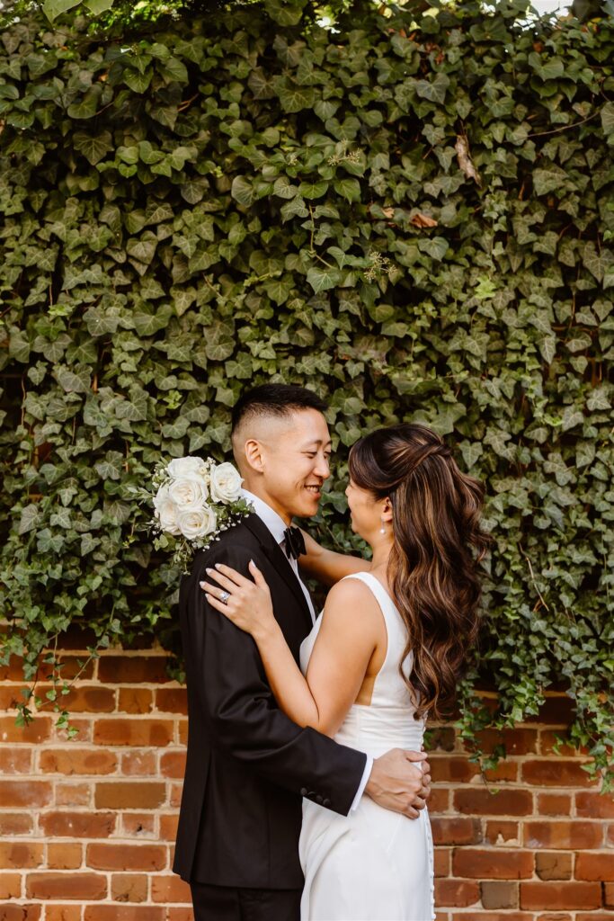 playful bride and groom wandering the cobblestone streets of georgetown, dc
