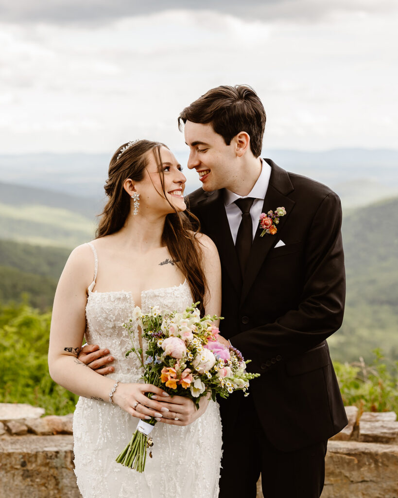 bride and groom at a mountain overlook during their shenandoah national park elopement