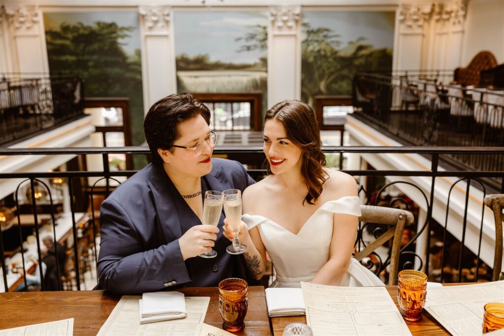 elopement couple toasting with champagne