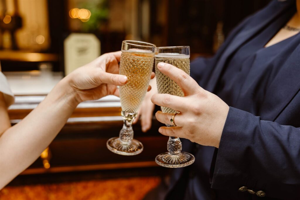 elopement couple toasting with champagne