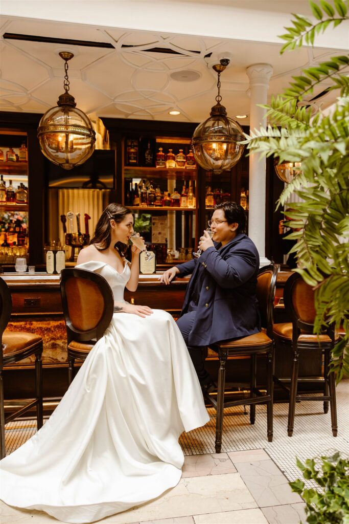 elopement couple sitting at a bar and enjoying their day