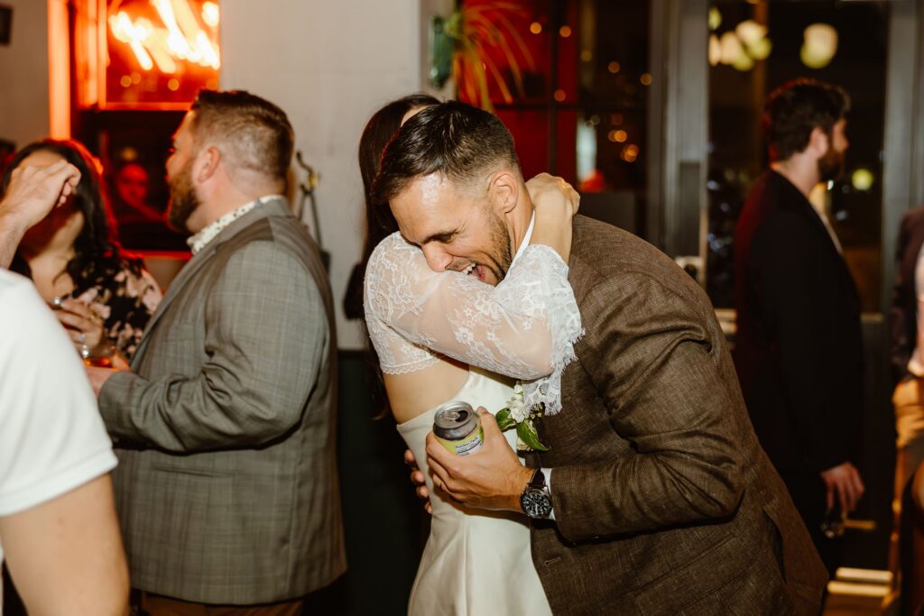 candid micro wedding reception moments at a pizza shop, a non traditional wedding venue in DC