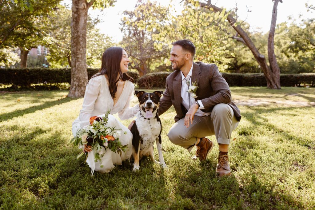 elopement couple posing with their dog in Stanton Park