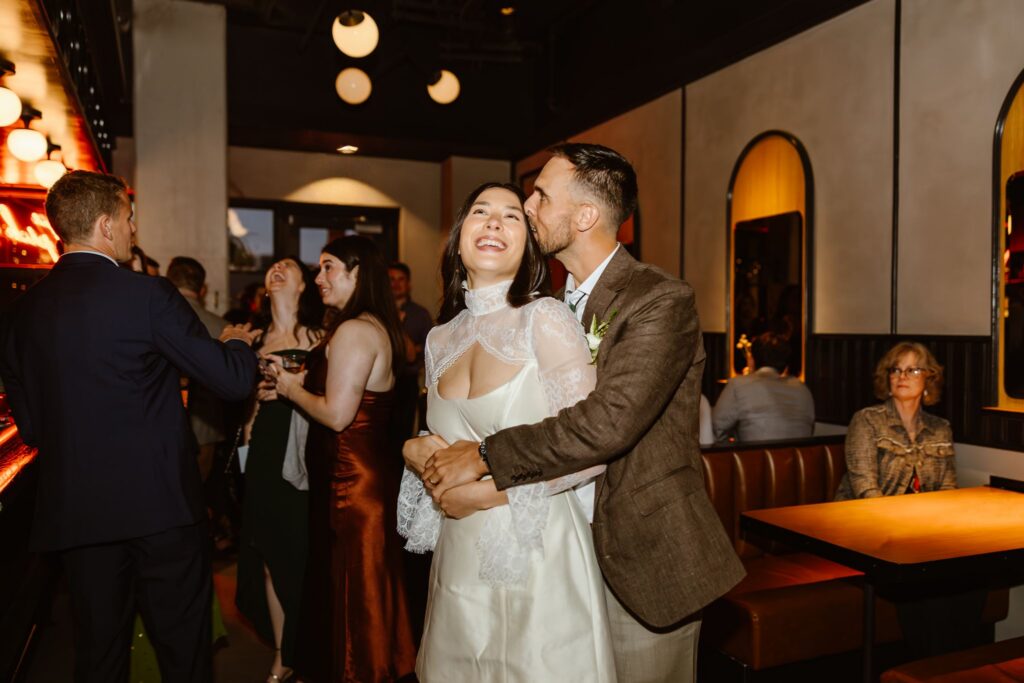 candid micro wedding reception moments at a pizza shop, a non traditional wedding venue in DC