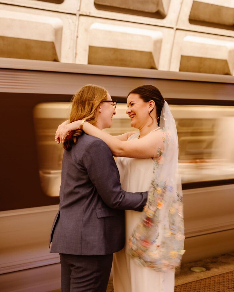 playful queer couple in the dc metro station during their elopement