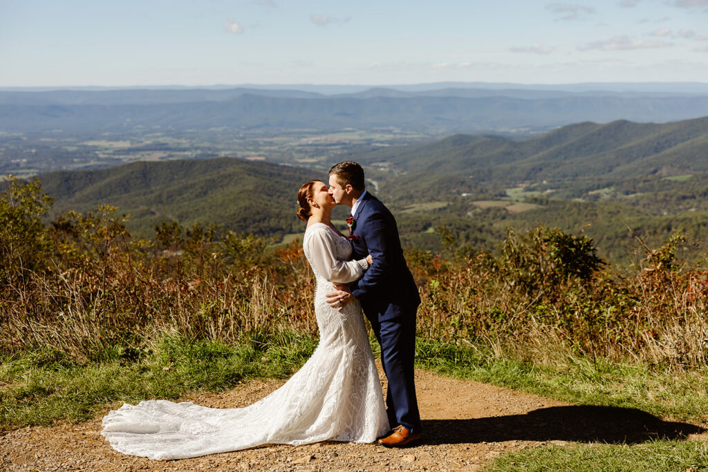 elopement couple kissing at a mountain overlook in shenandoah national park