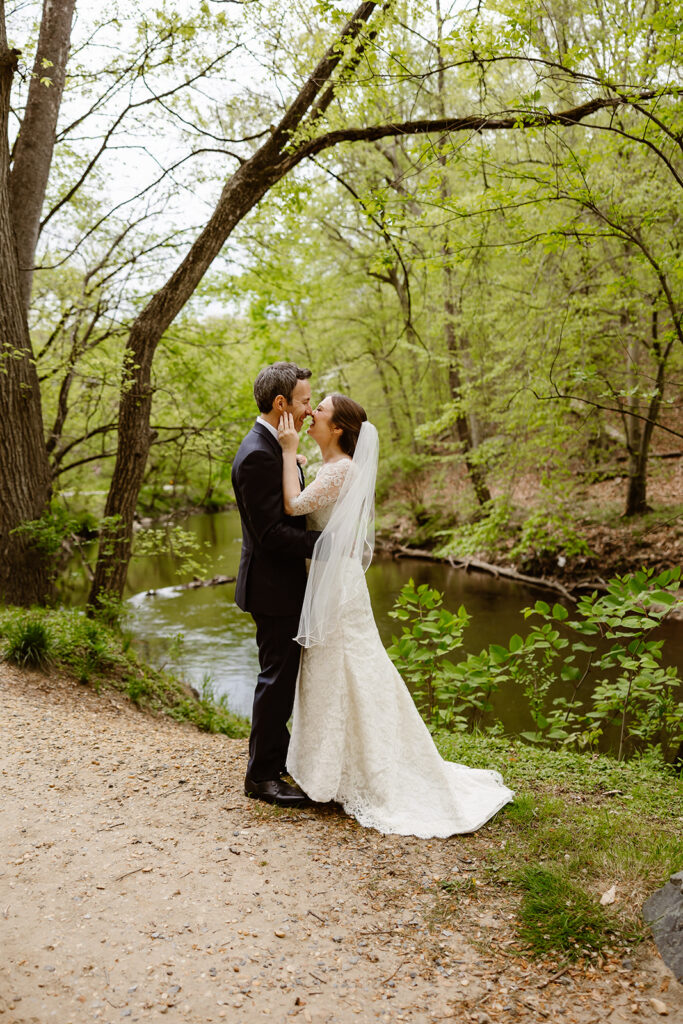 elopement couple hugging in front of water