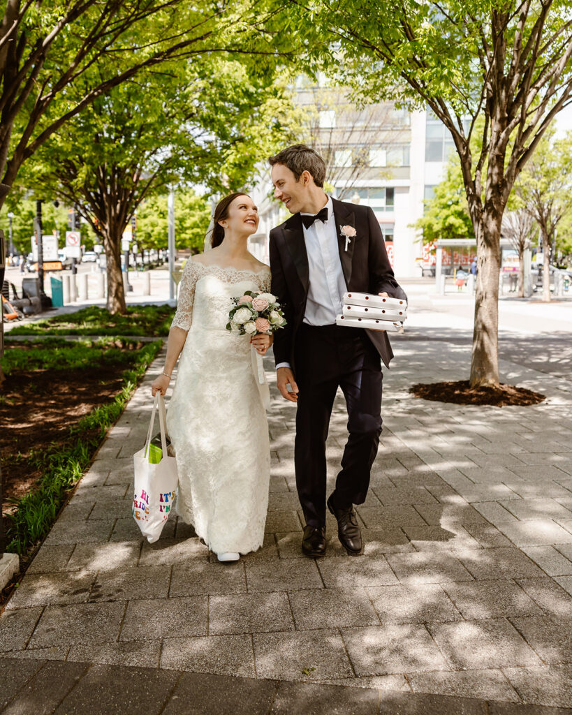elopement couple on their way to enjoy a wiseguy pizza picnic